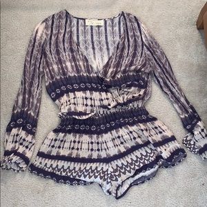 Purple patterned deep cut romper